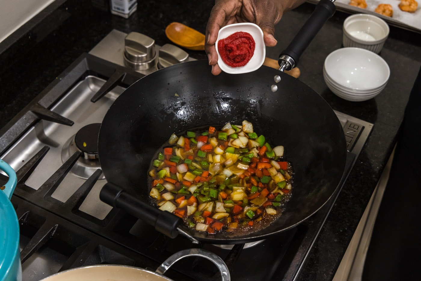tomato paste added to skillet with vegetables