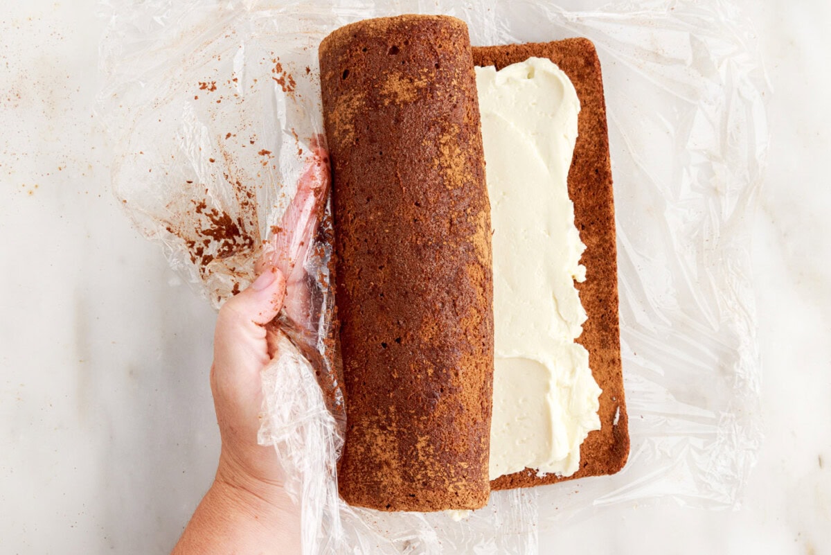rolling swiss log cake with buttercream filling