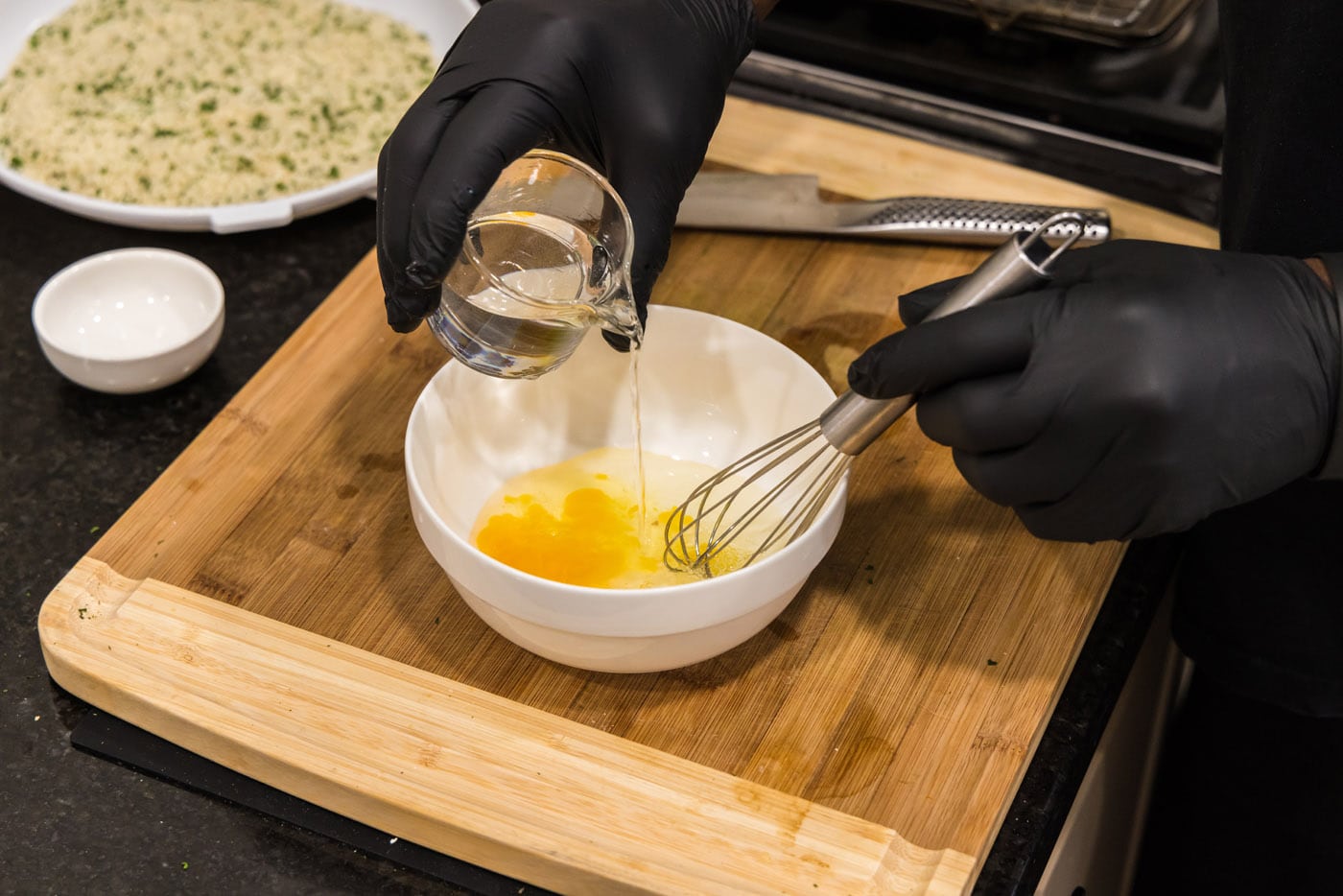 whisking egg with water