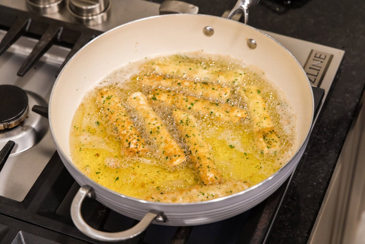 deep fried wonton cheese sticks in a skillet