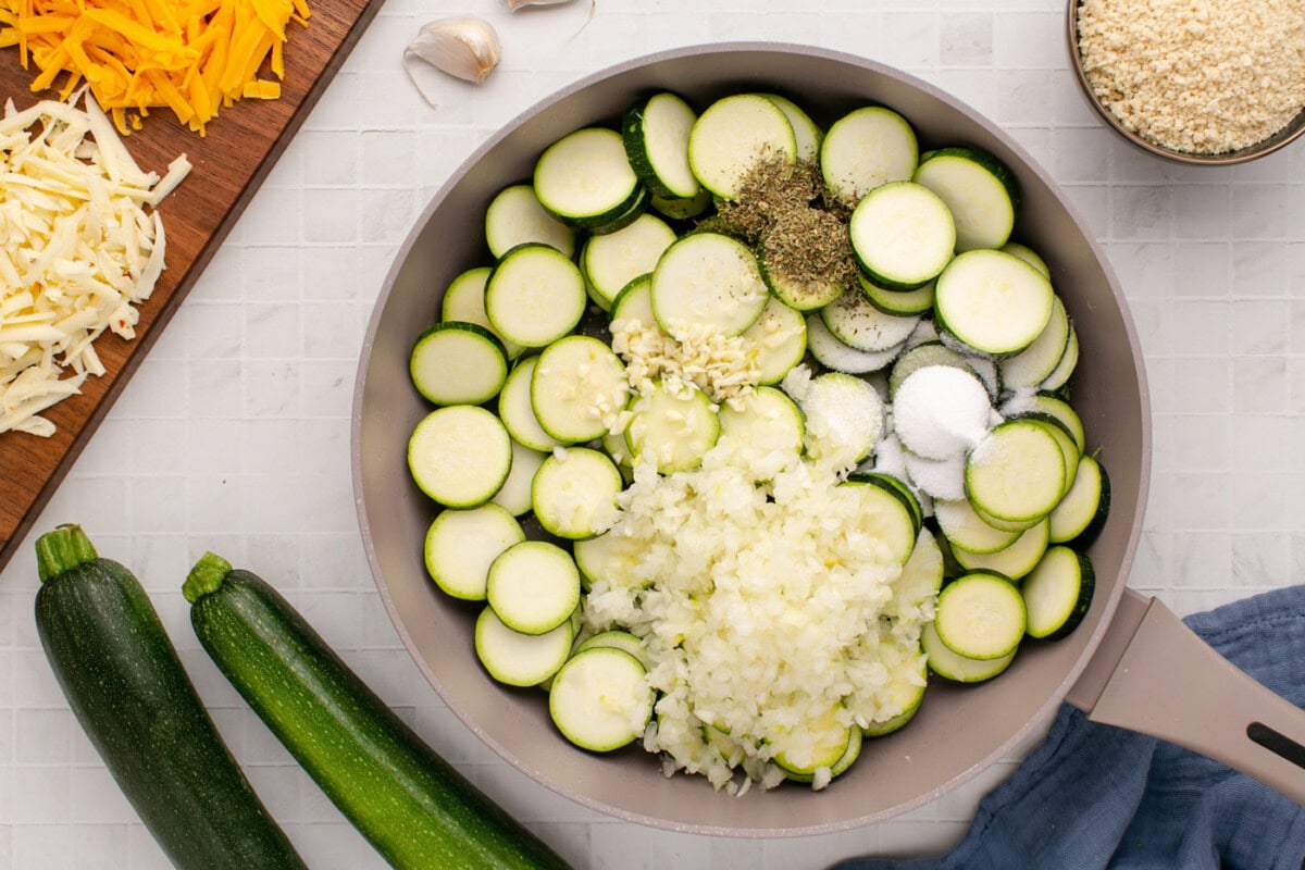 zucchini in skillet with onion, garlic, and seasonings