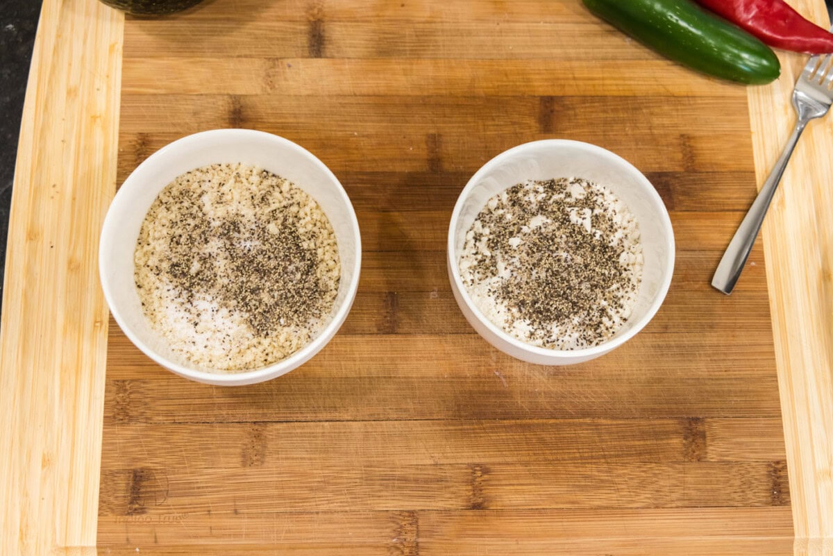 breadcrumbs in a bowl with seasoning nextto flour mixture in a bowl
