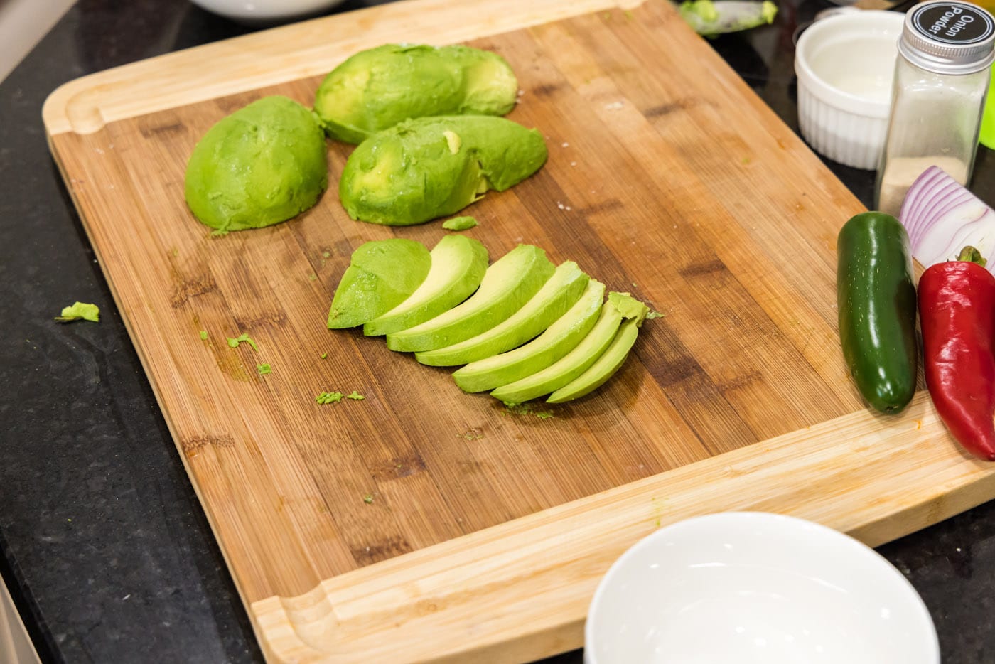 sliced avocado on a cutting board