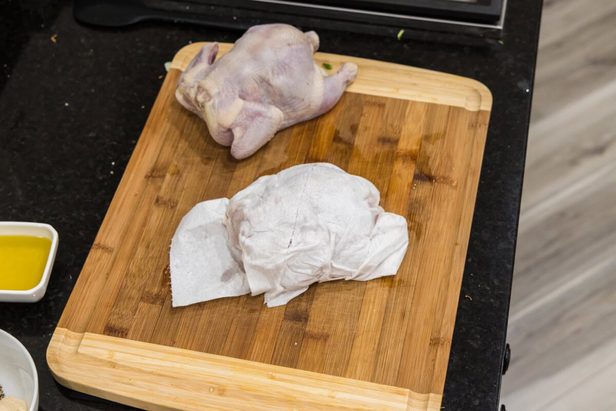 cornish hens on a wood cutting board