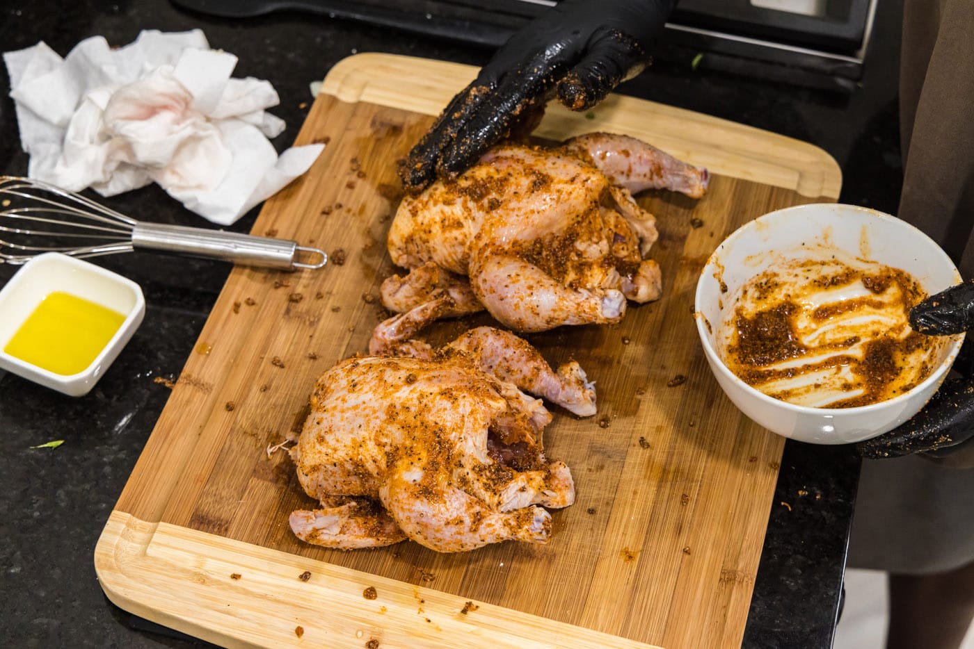 rubbing cornish hens in spices and seasonings