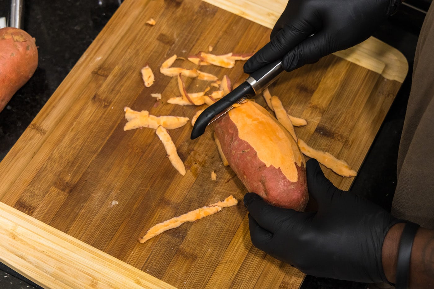 peeling sweet potatoes