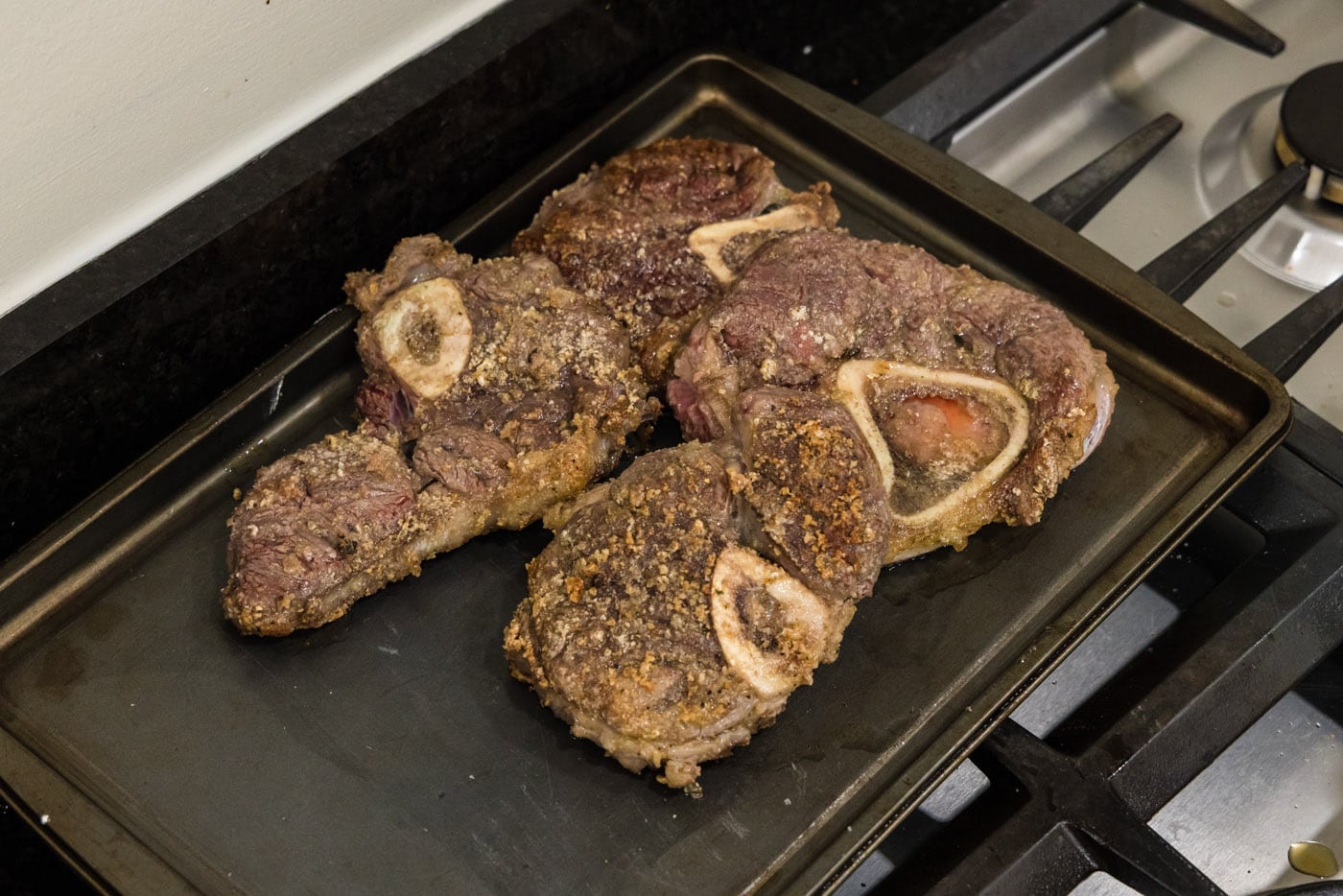 seared beef shanks on a baking pan