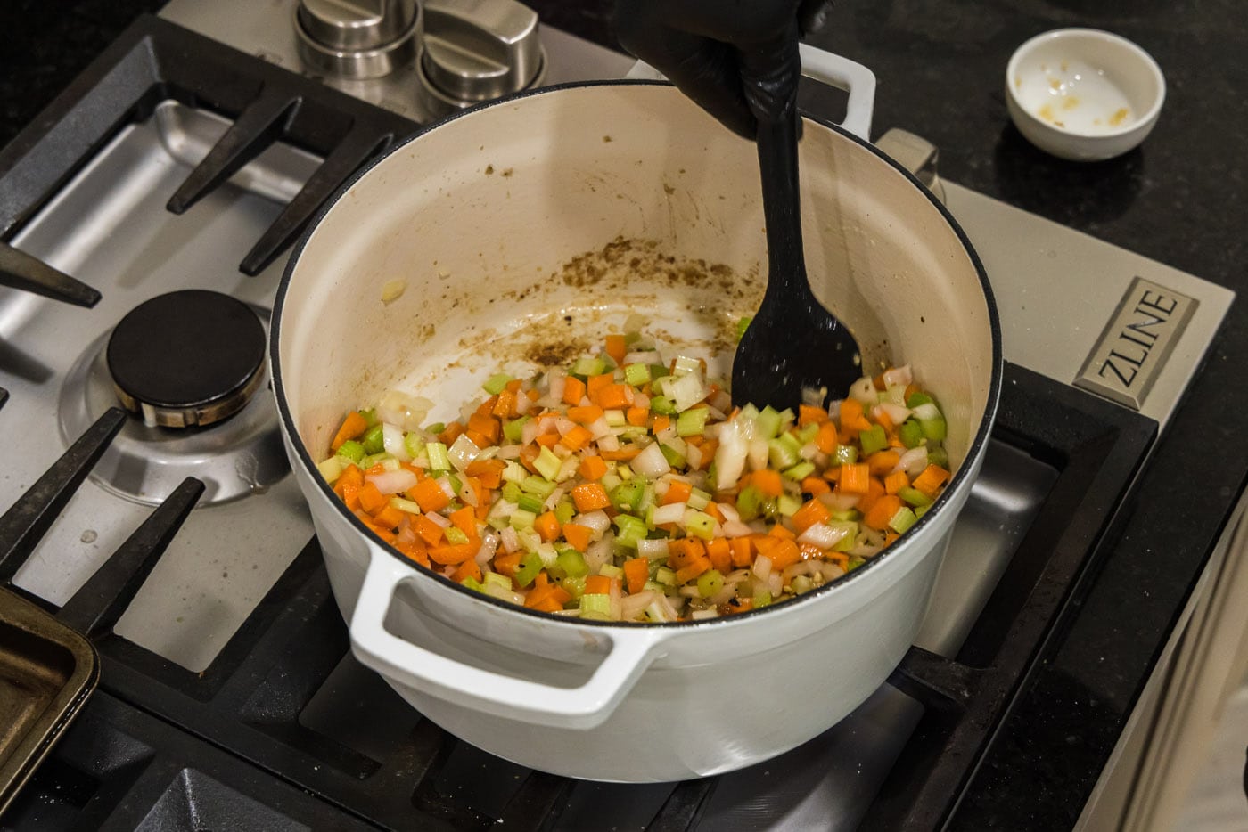 stirring vegetables in dutch oven