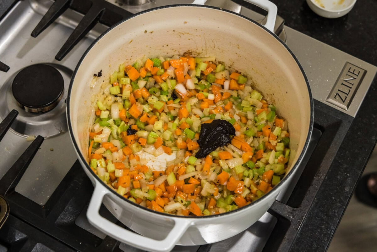 beef base added to vegetables in pot