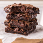 Stack of Cake Mix Brownies with a bite taken out of the top one