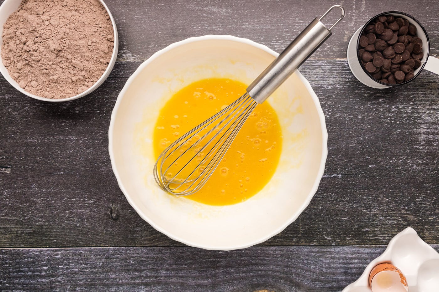 eggs, oil, and vanilla whisked in a bowl
