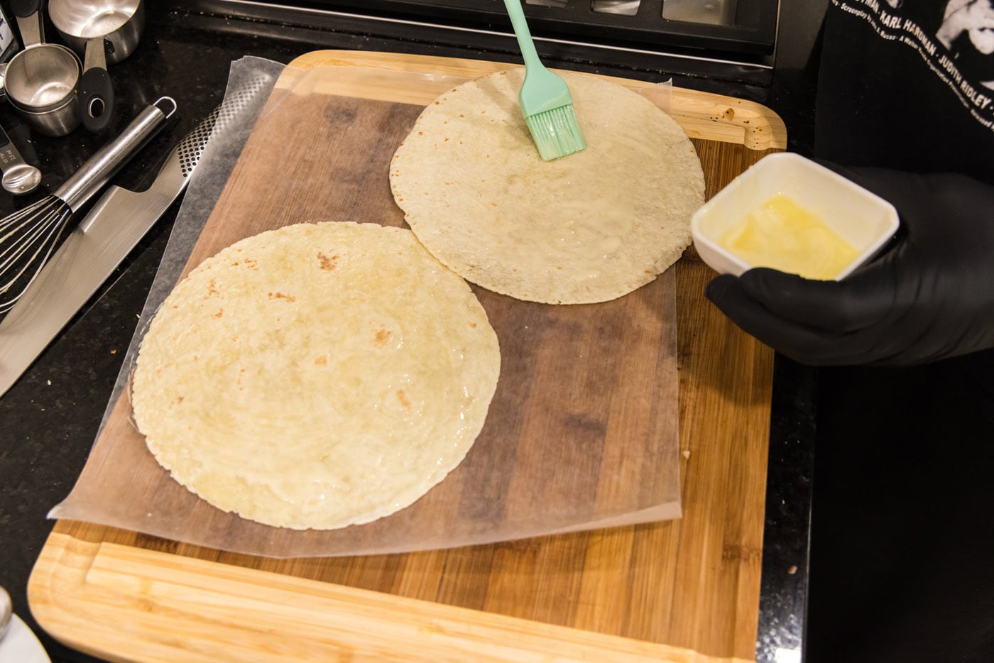 basting tortillas with melted butter