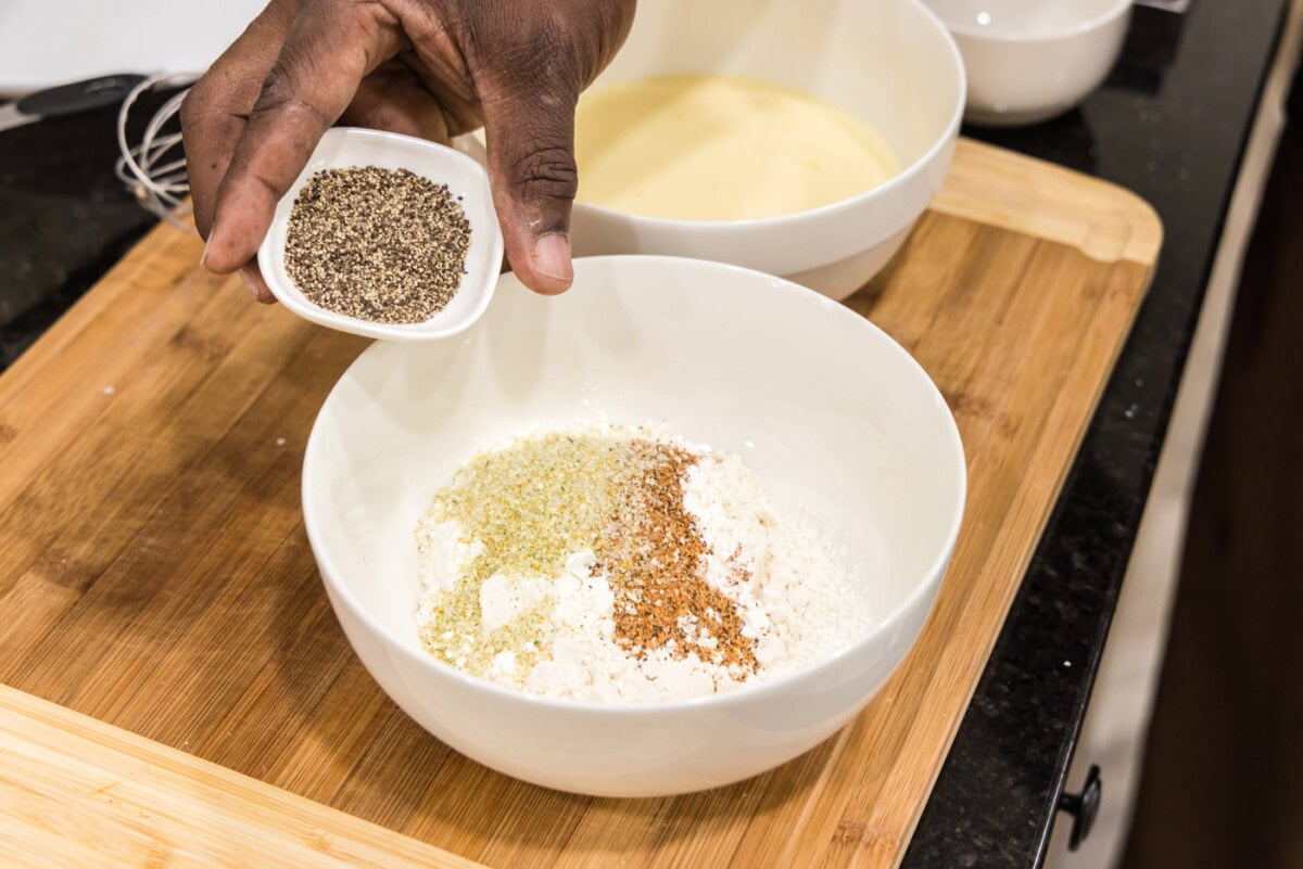 adding pepper to flour mixture