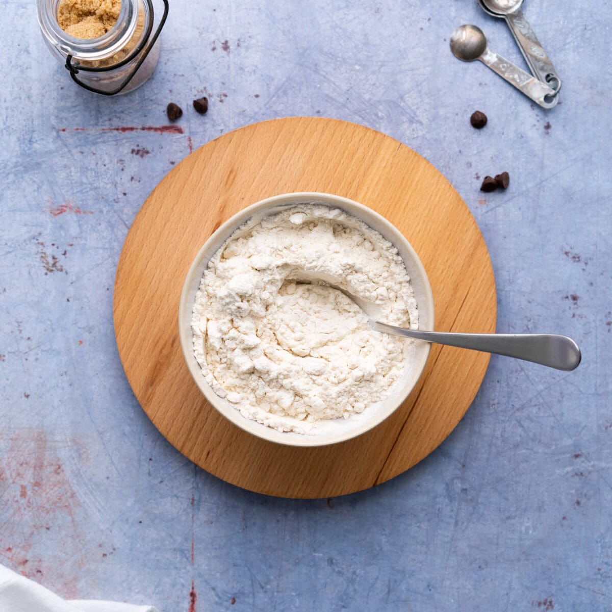 all purpose flour in a bowl with a spoon