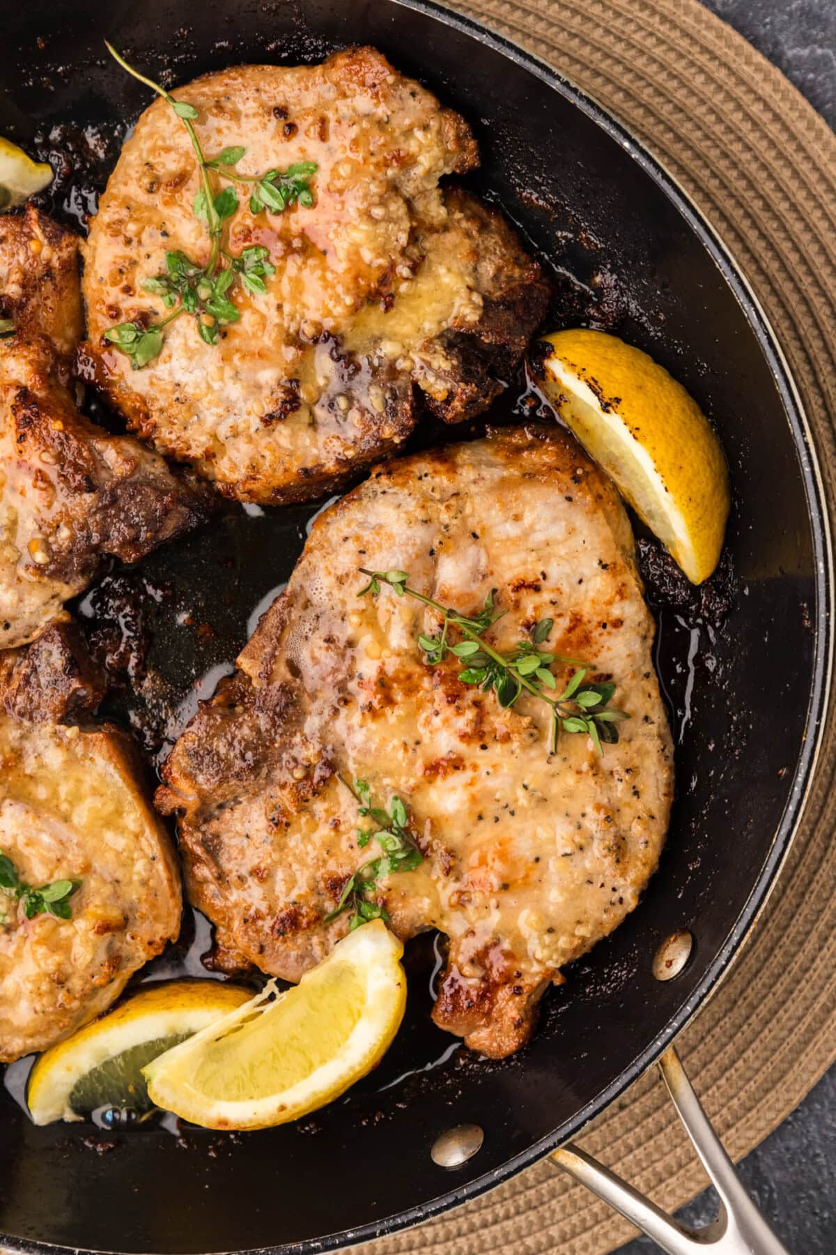 Close up photo of Garlic Butter Pork Chops in a skillet