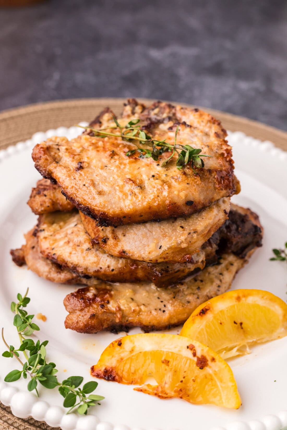 Stack of Garlic Butter Pork Chops on a plate