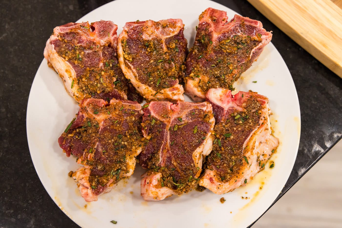 seasoned lamb loin chops on a plate