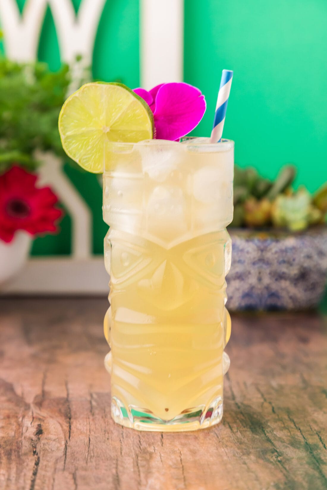 Side photo of a Jamaican Mule garnished with a lime wheel and flower