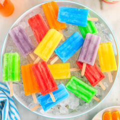 Jello Popsicles resting over a bowl of ice