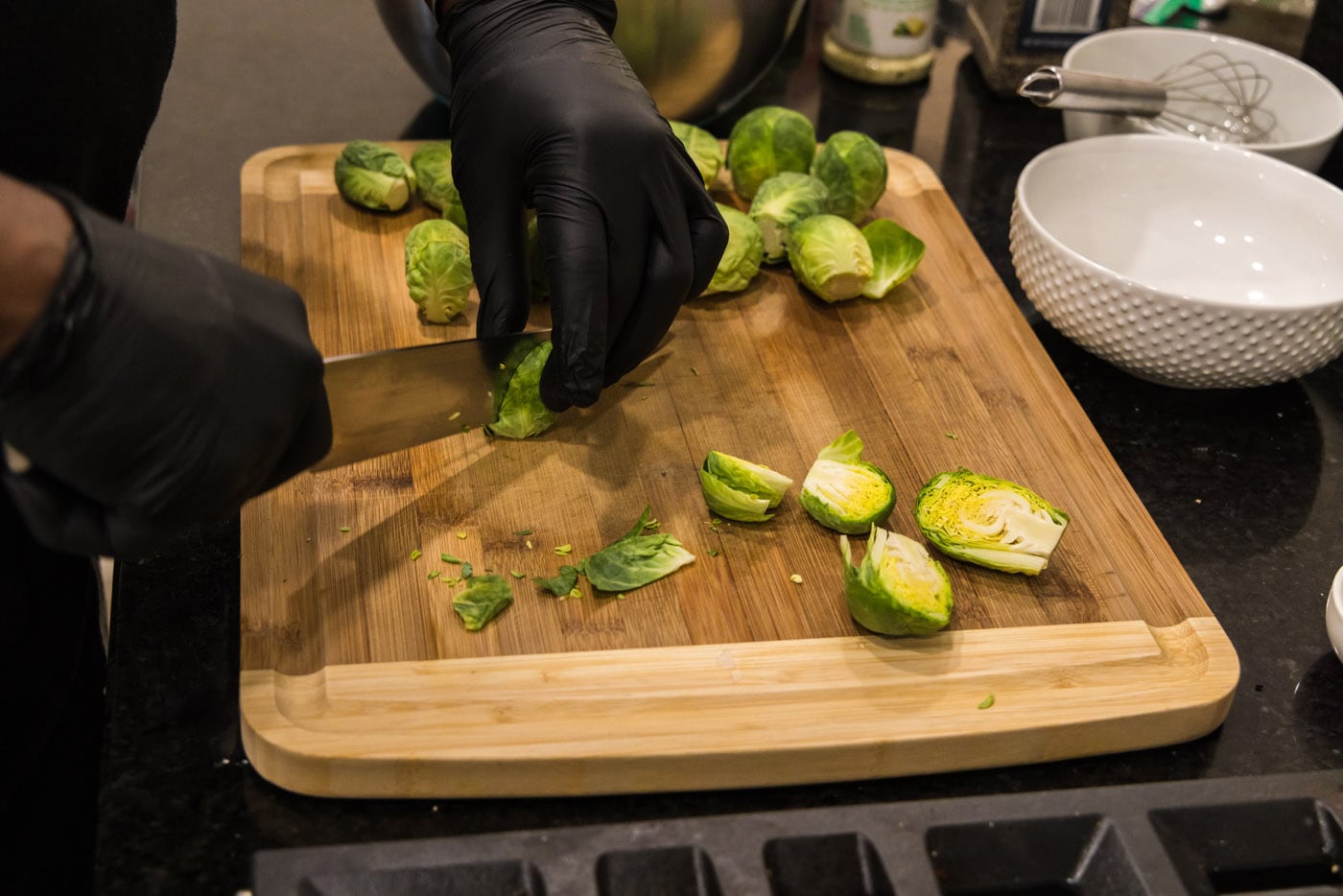 slicing brussels sprouts in half