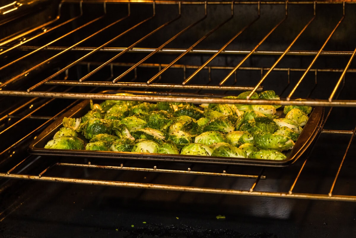 brussels sprouts on a baking sheet in the oven