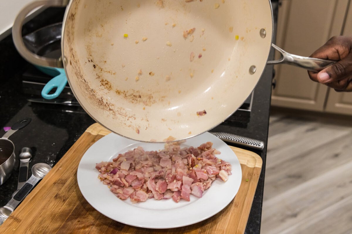 transferring shallot and bacon mixture to a plate