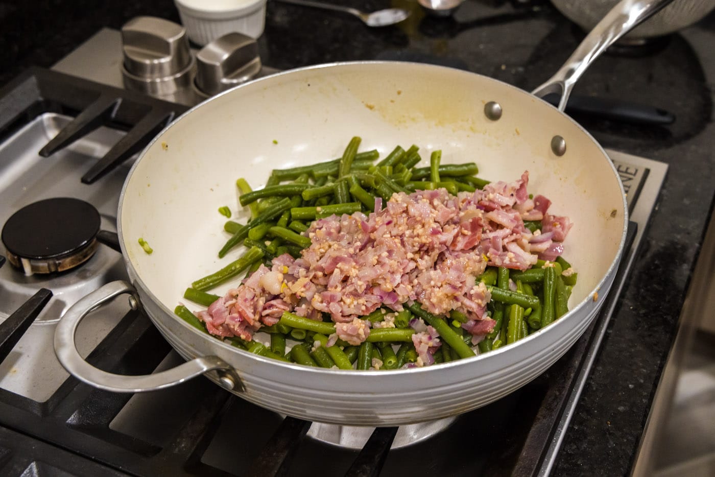 adding shallots, bacon, and garlic to southern green beans