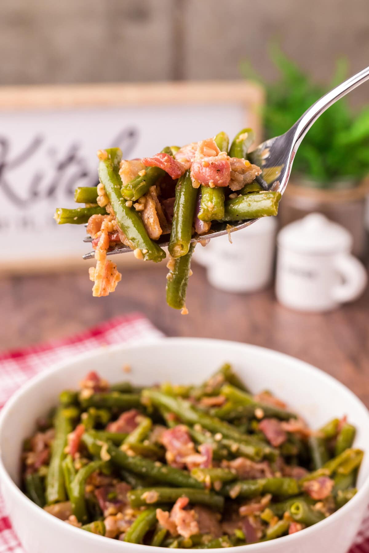 Fork full of Southern Green Beans being lifted out of a bowl of Southern Green Beans