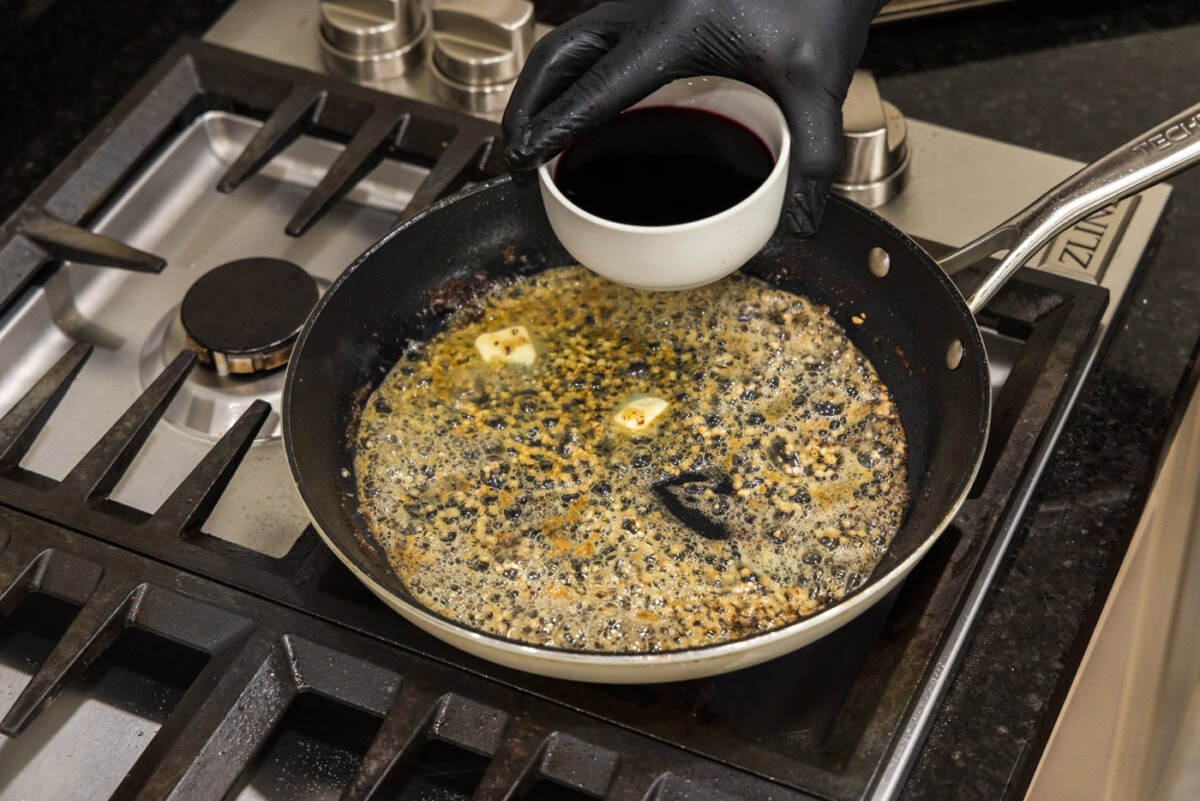 adding marsala wine to butter and garlic