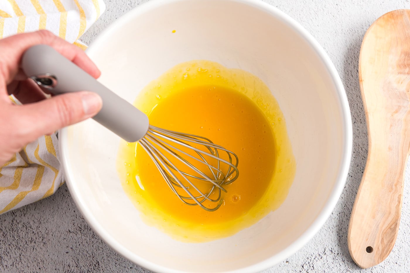 Whisked egg yolks in a bowl