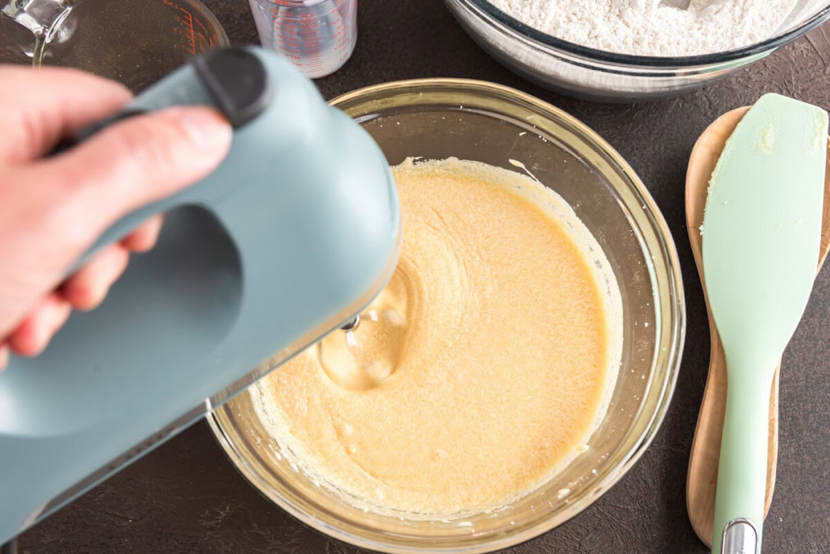 mixer combining ingredients for donuts