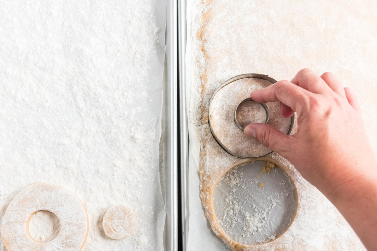 cutting out donut shapes with a biscuit cutter