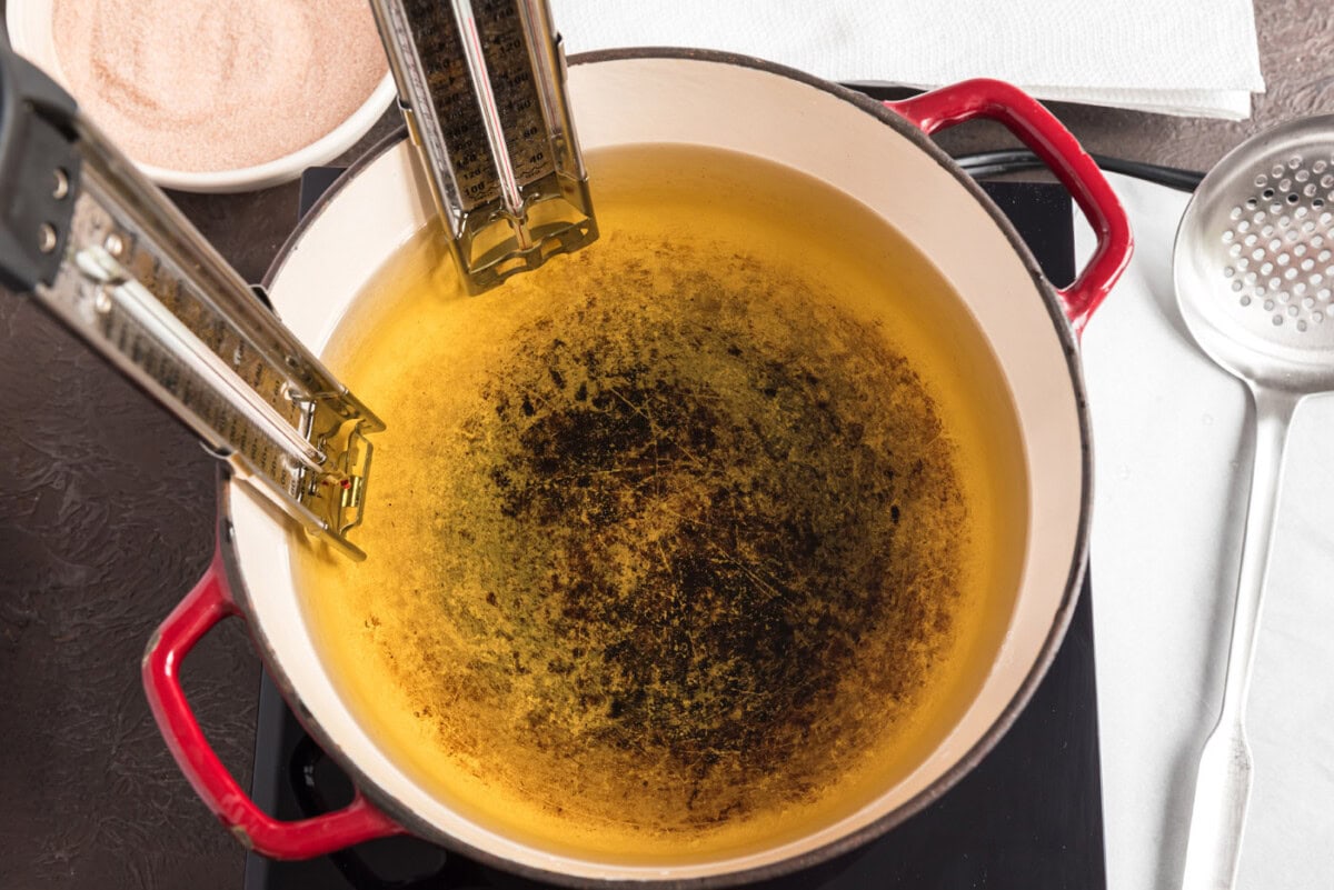 oil in a saucepan with a thermometer