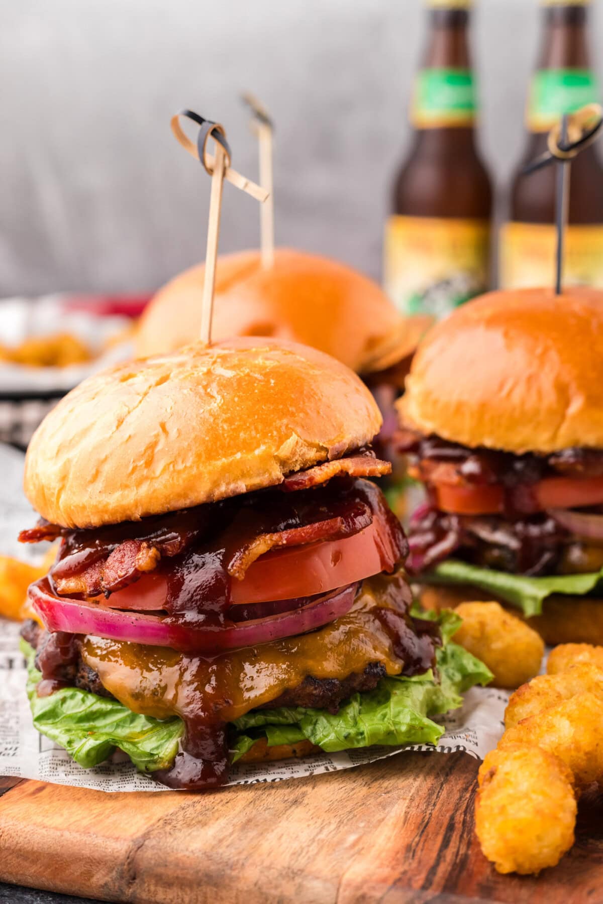 BBQ Bacon Burgers on a wooden board