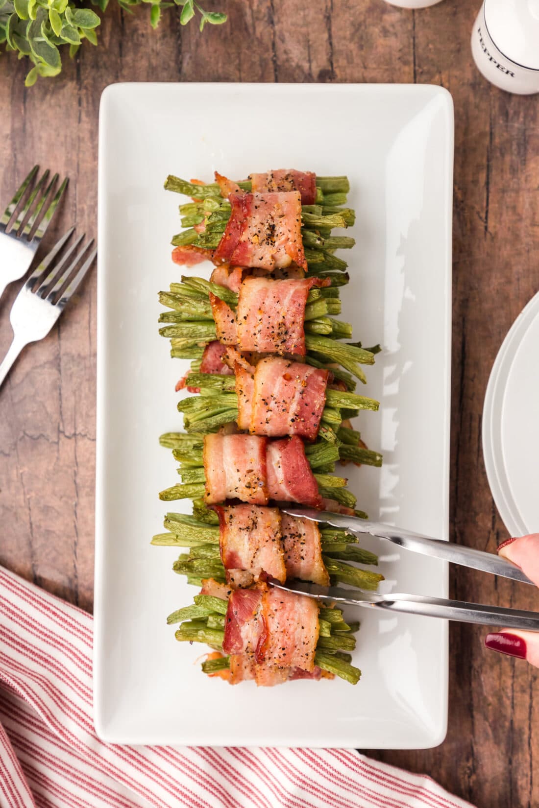 Bacon Wrapped Green Beans stacked on a serving platter