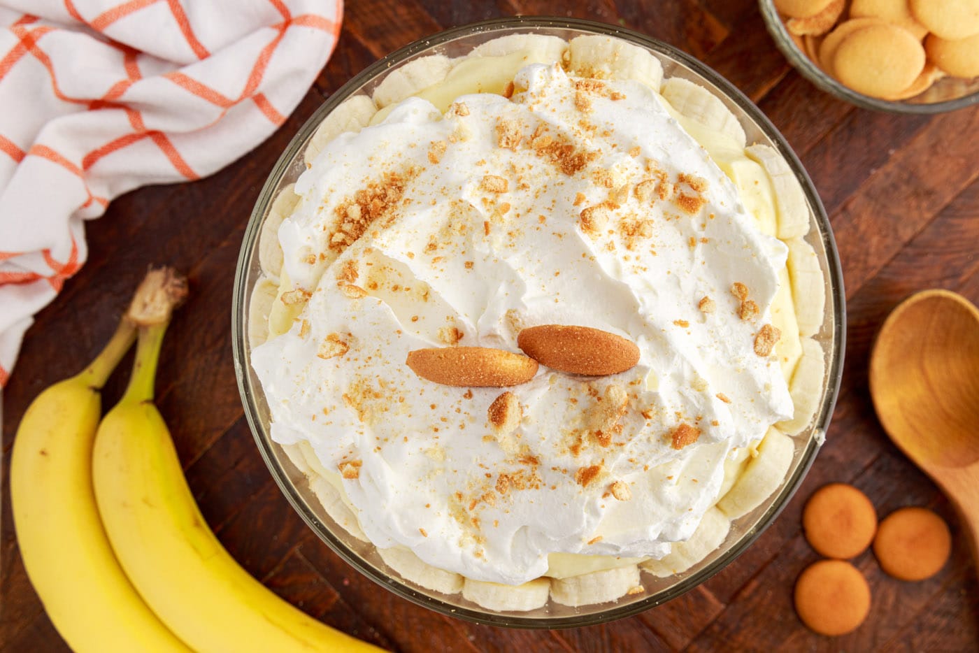garnished banana trifles with whipped cream and nilla wafers