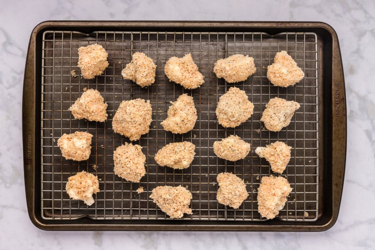 panko breadcrumb coated cauliflower florets on a wire rack