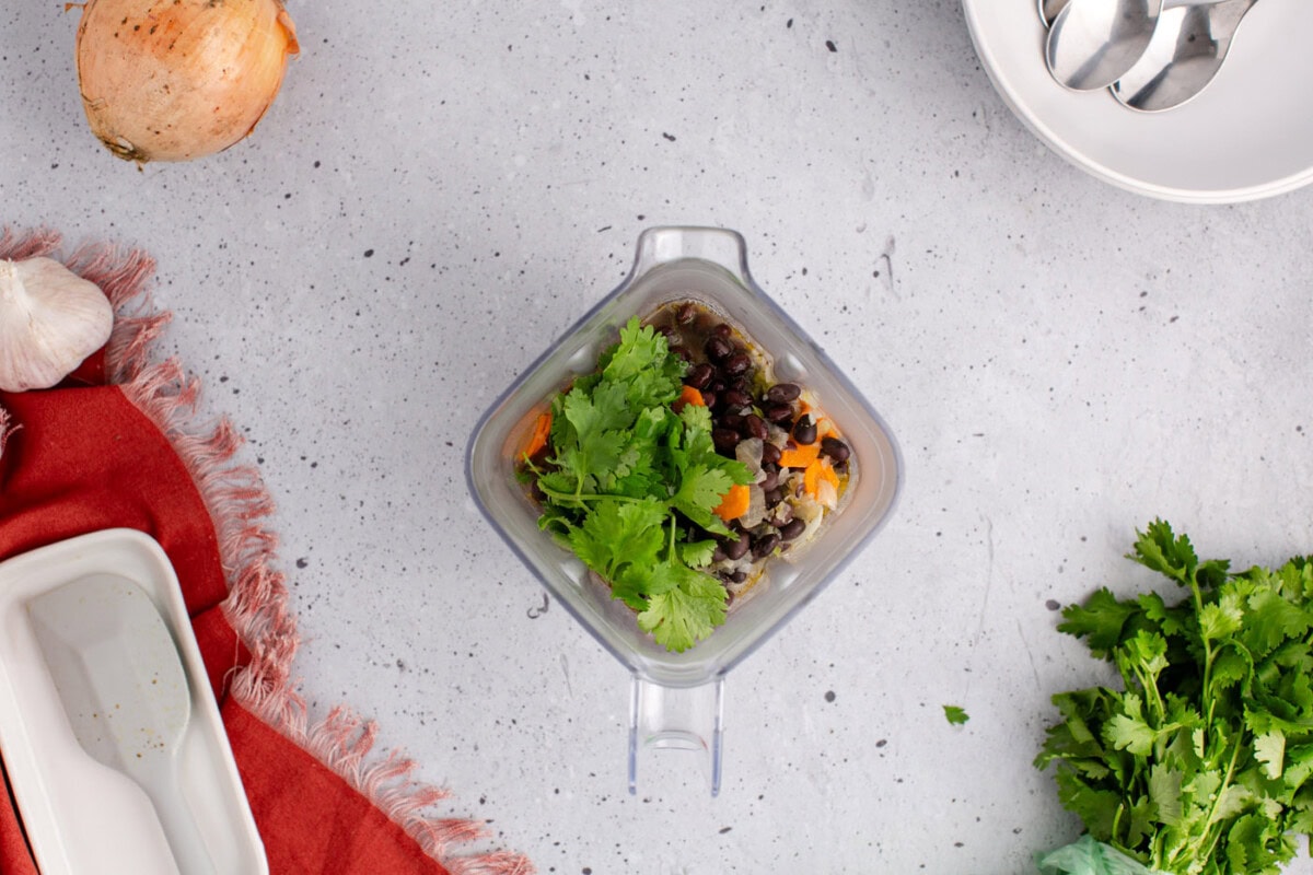 portion of black bean soup in a blender