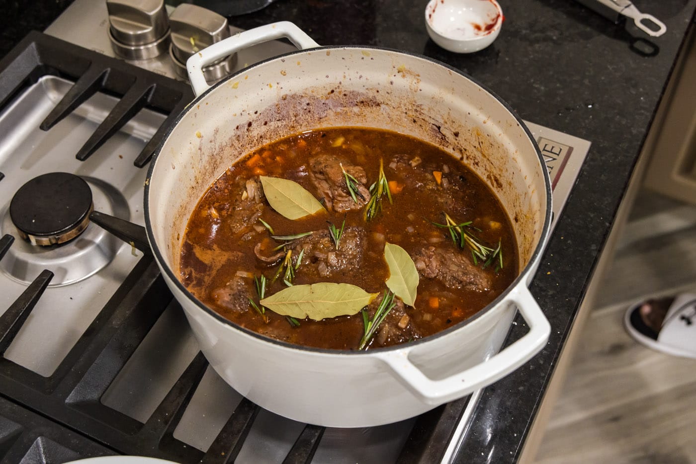 braised beef short ribs in red wine sauce with rosemary and bay leaves