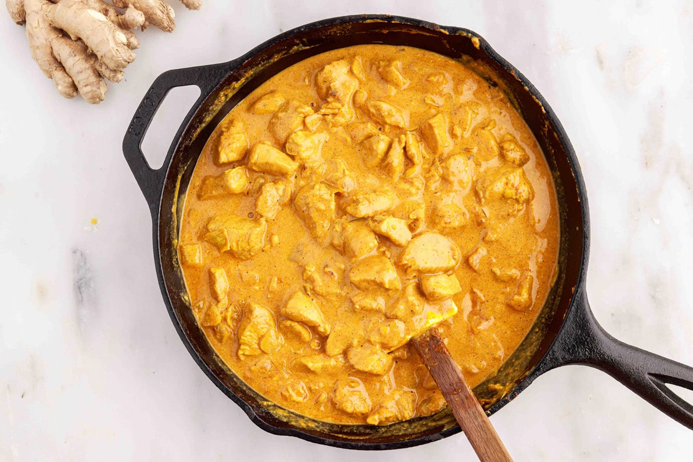 creamy chicken curry in a skillet
