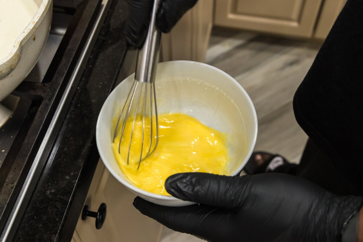 whisking eggs in a bowl