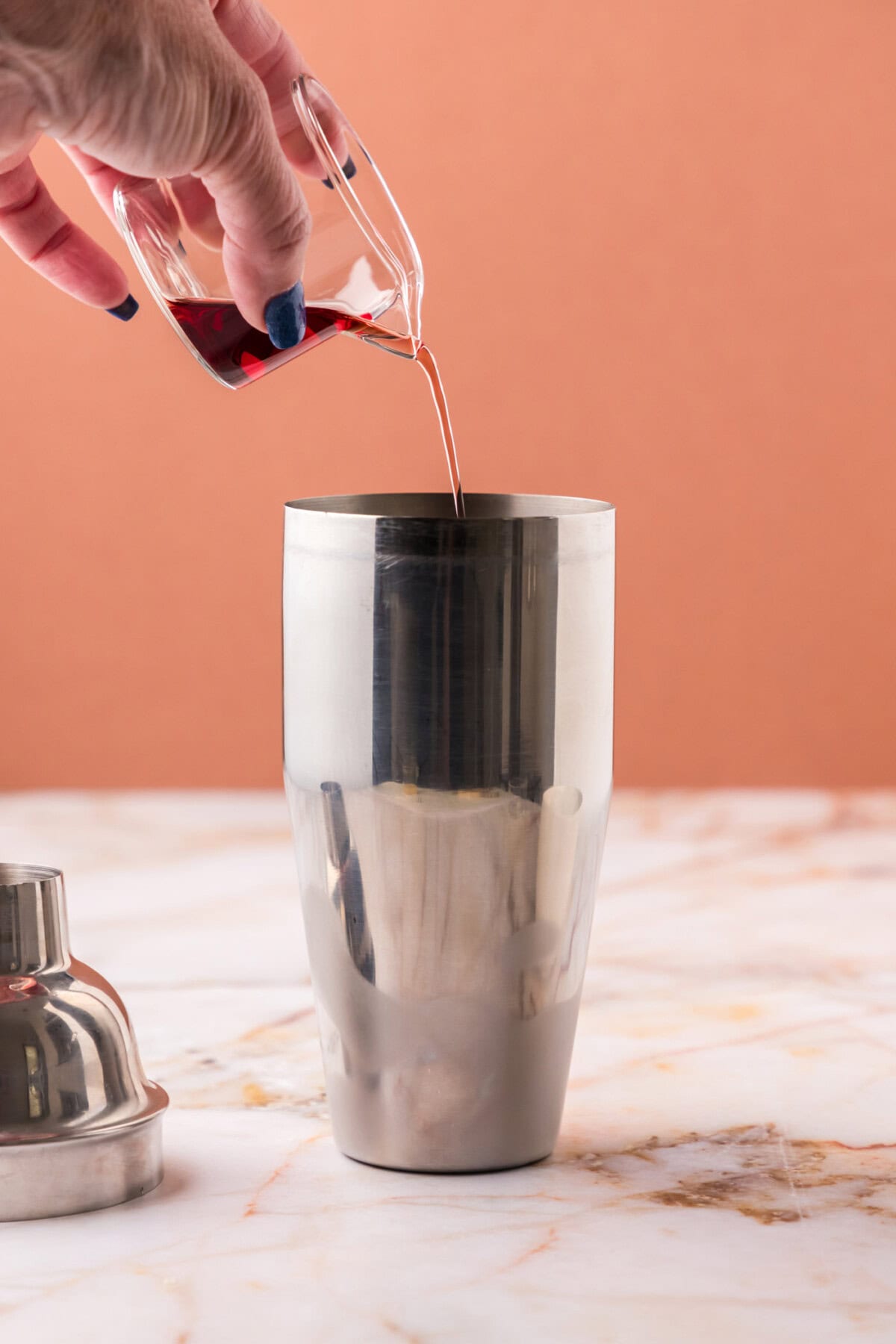 pouring chambord into cocktail shaker