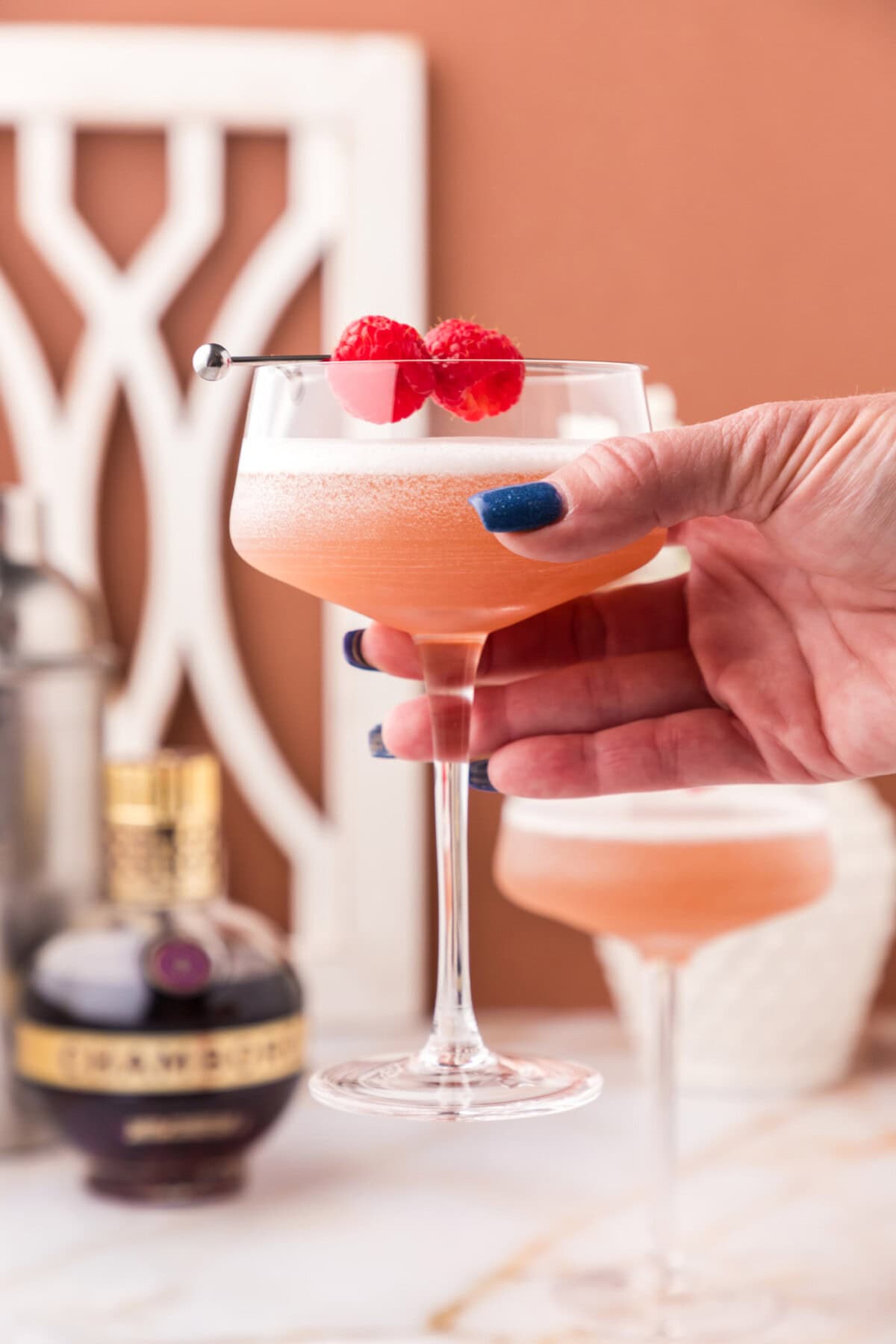 Hand holding up a French Martini
