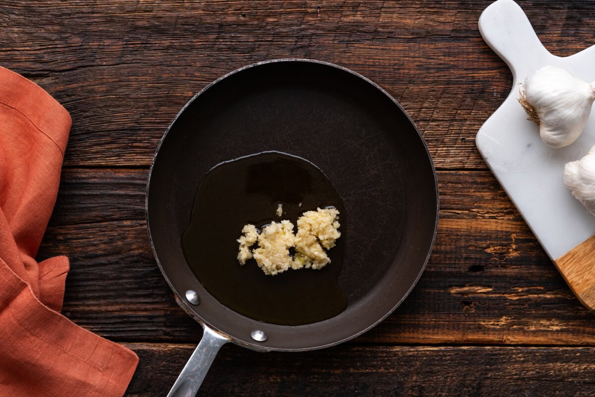 minced garlic in a skillet with oil