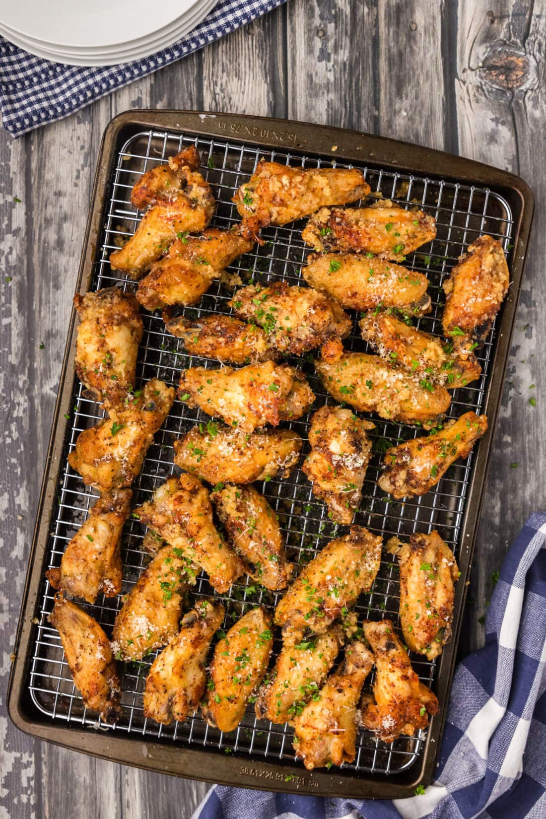 Garlic Parmesan Wings resting on a wire rack