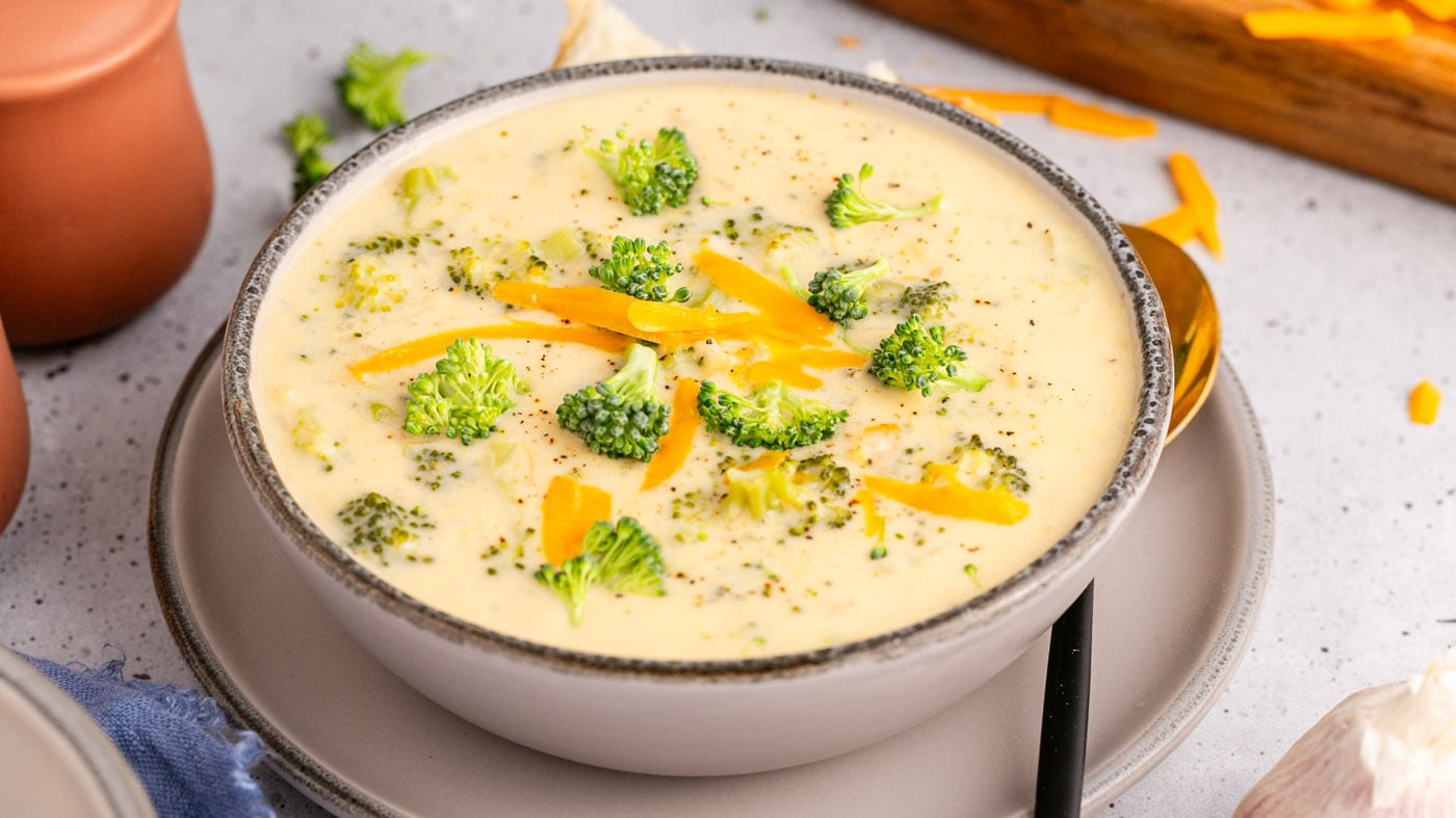 Instant pot broccoli cheddar soup has plenty of garlic, onion, broccoli, shredded carrots, and chedd