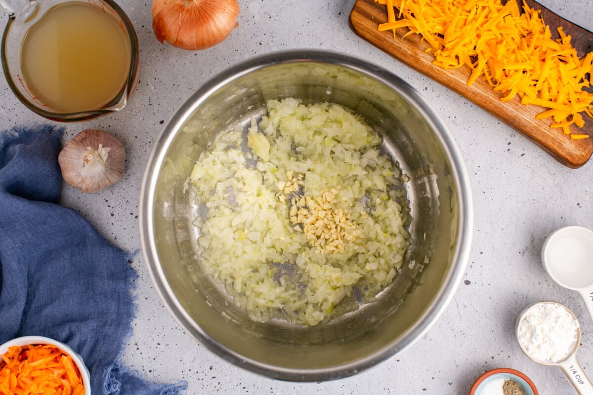 garlic added to melted butter and onion mixture in an instant pot