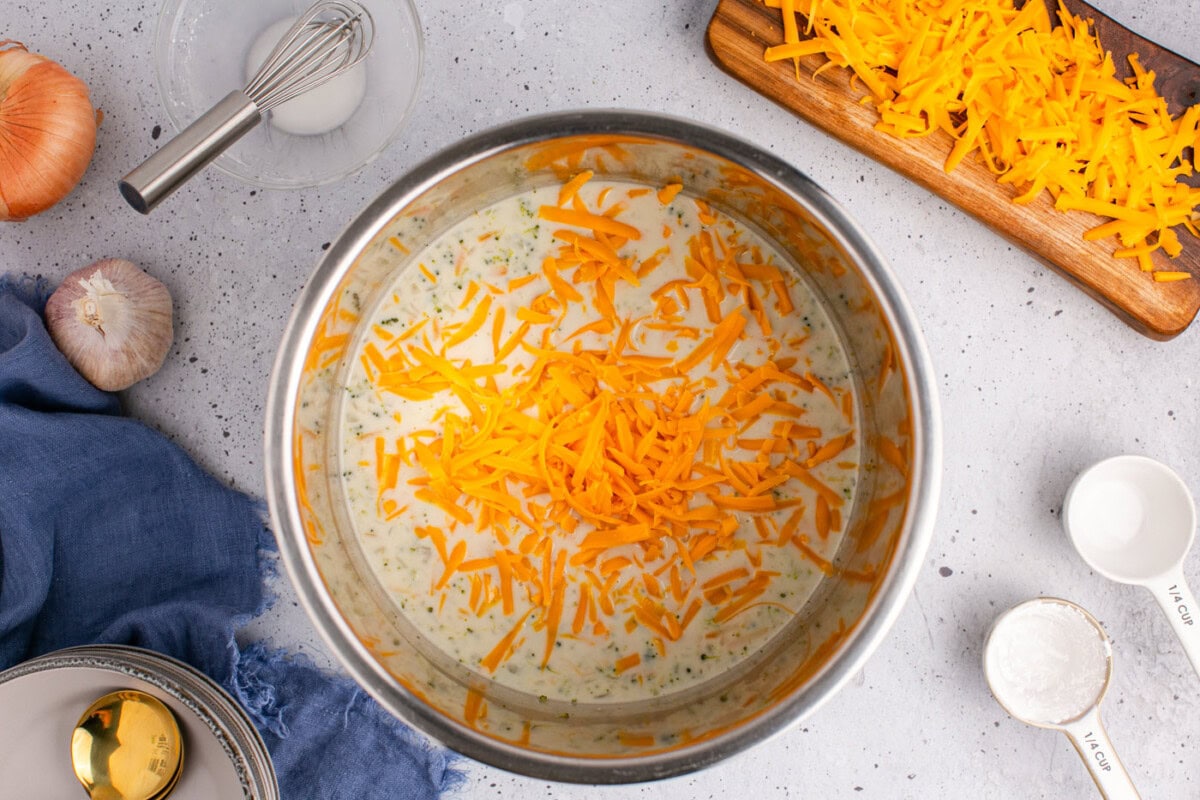 grated cheddar cheese added to broccoli cheddar soup with half and half