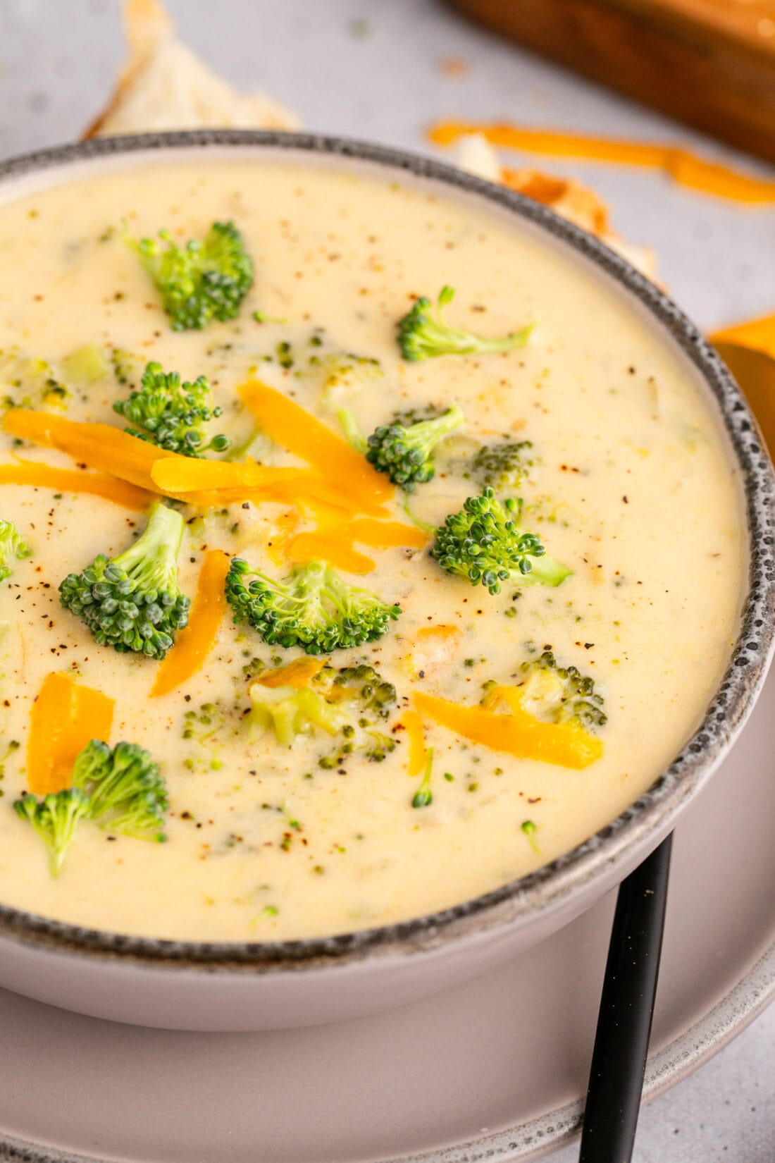 Close up photo of a bowl of Instant Pot Broccoli Cheddar Soup