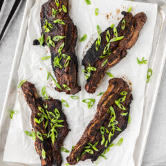 Korean Short Ribs on a sheet pan with parchment paper